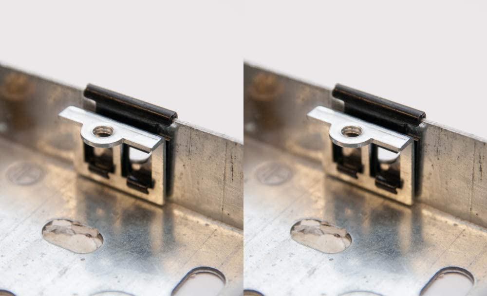Back box repair clip pushed onto a metal electrical back box to replace a broken lug or thread – image 3