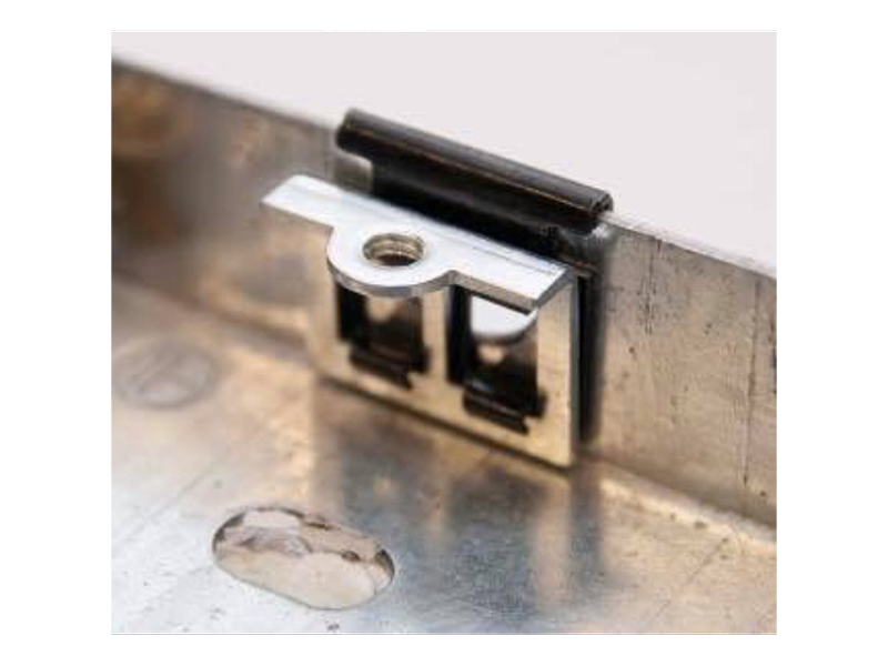 Back box repair clip pushed onto a metal electrical back box to replace a broken lug or thread